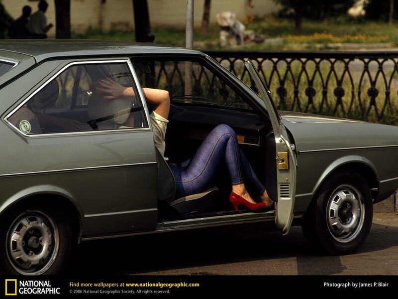 Woman in car with open door