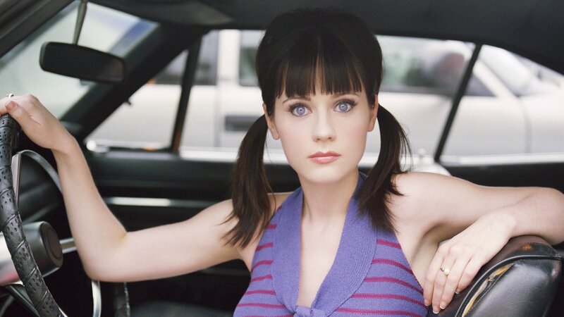 woman in car with pigtails
