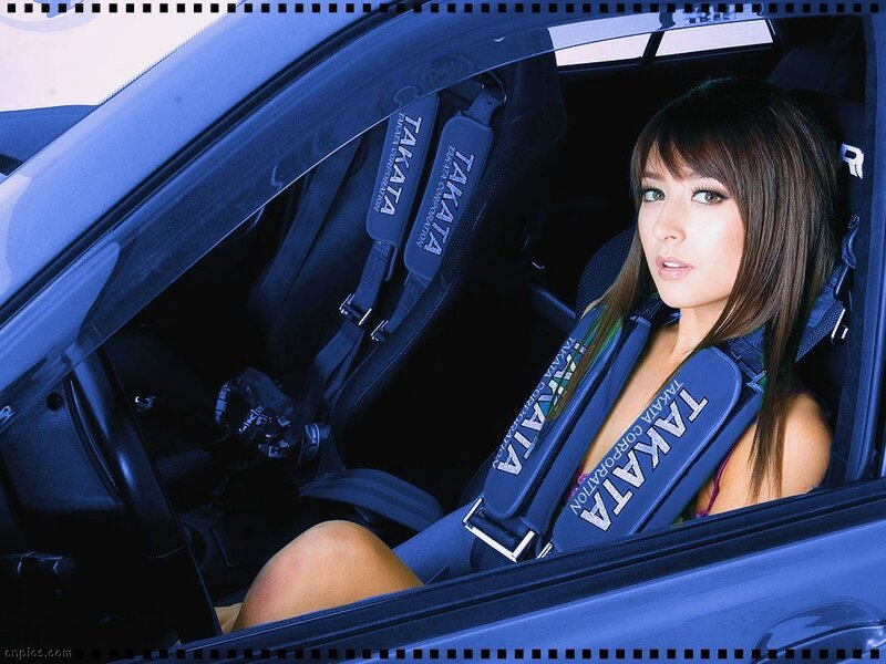 woman in car with racing harness