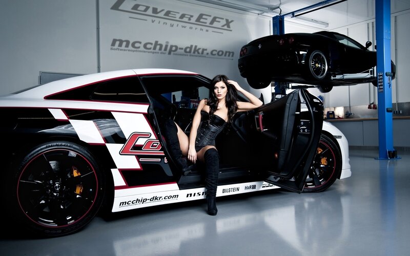woman in car with racing livery