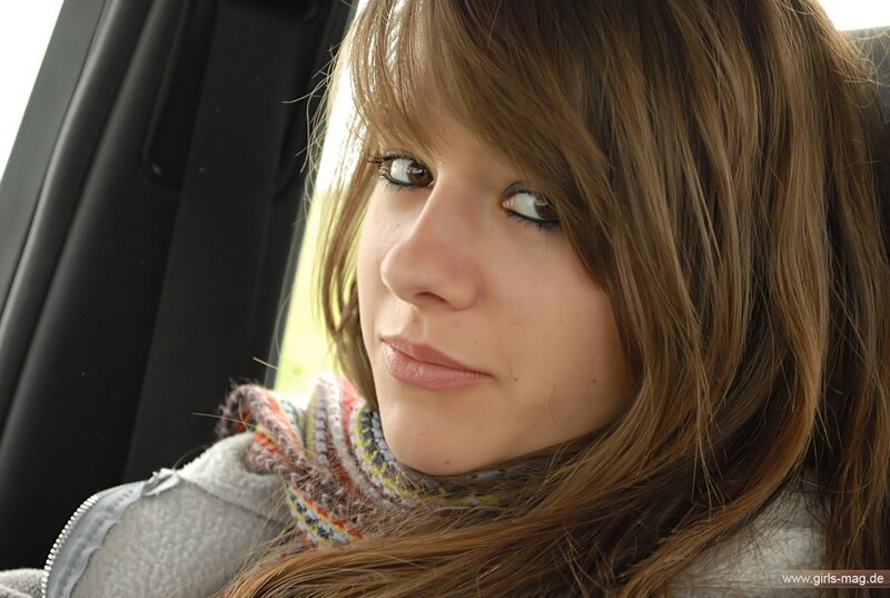 woman in car with scarf