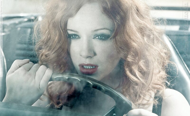 woman in car with steering wheel