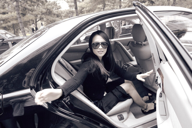 woman in car with sunglasses