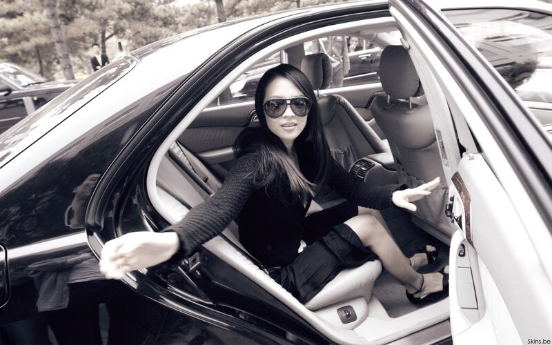 woman in car with sunglasses