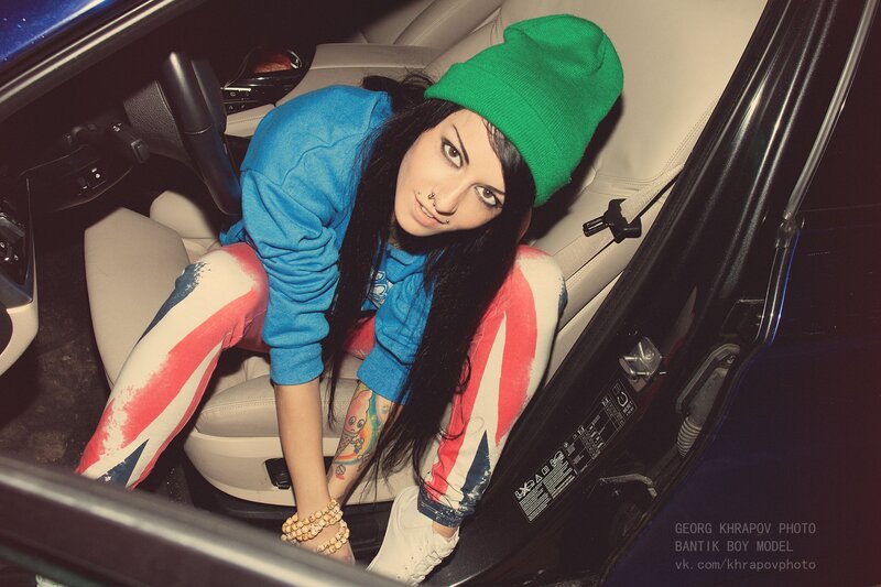 woman in car with tattoos