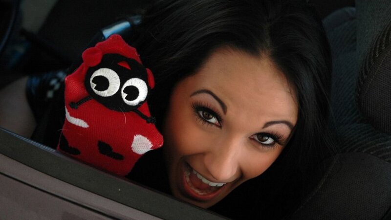 Woman in Car with Toy