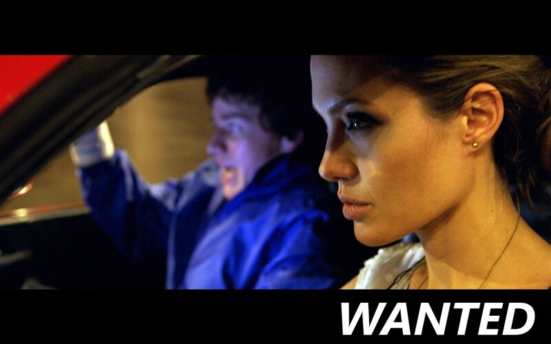 Woman in car with wanted poster