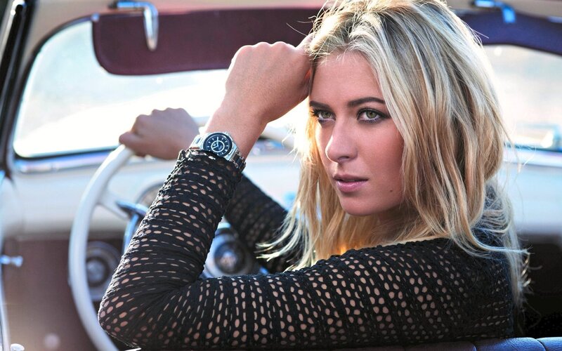 woman in car with watch