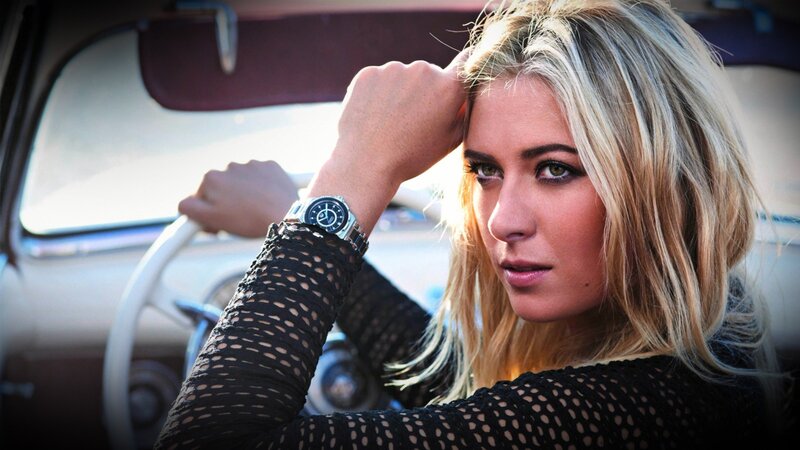 woman in car with watch