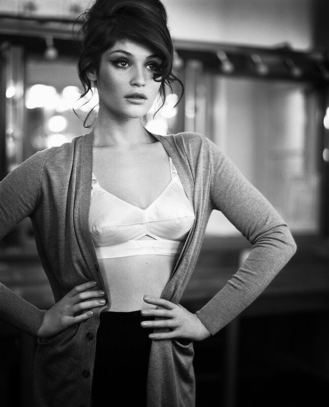 woman in cardigan and bra