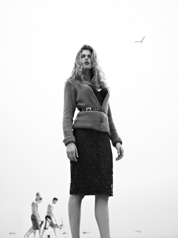 woman in cardigan on beach