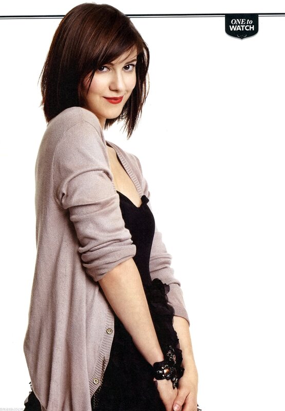 woman in cardigan smiling