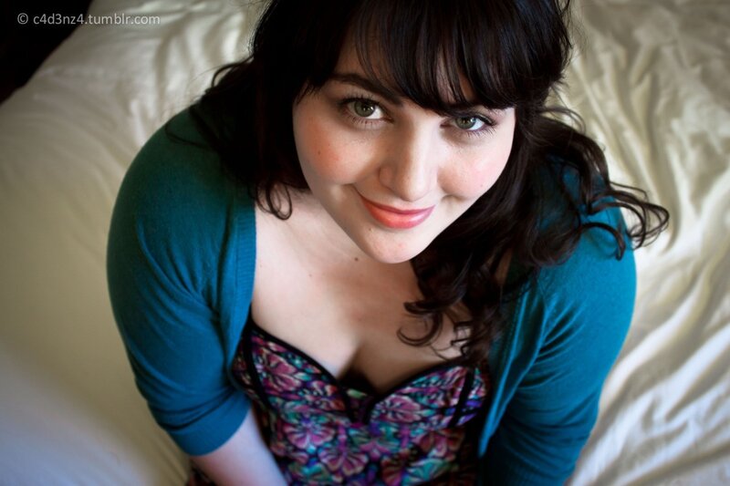 woman in cardigan smiling