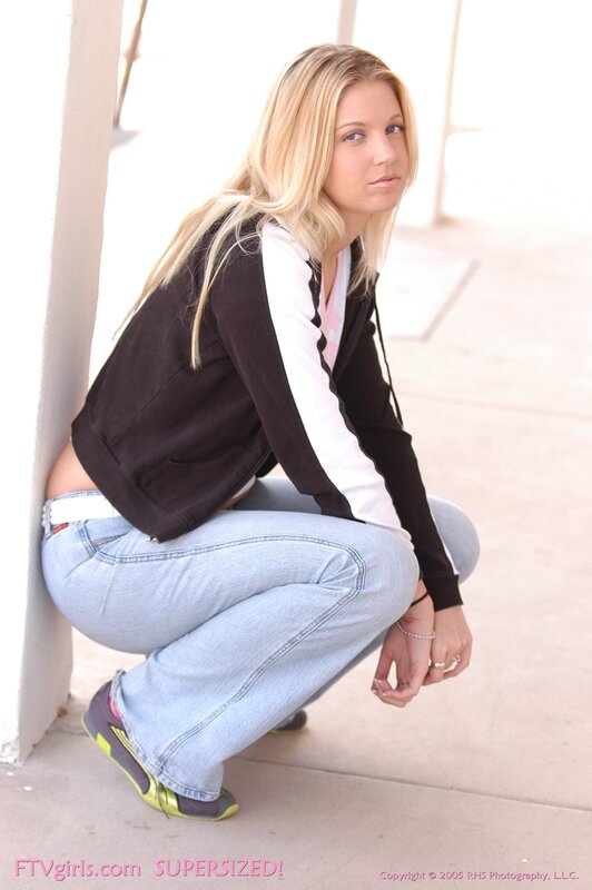 woman in casual clothes squatting