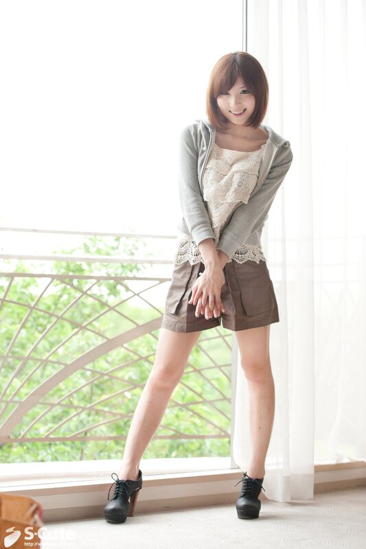 Woman in casual outfit by window