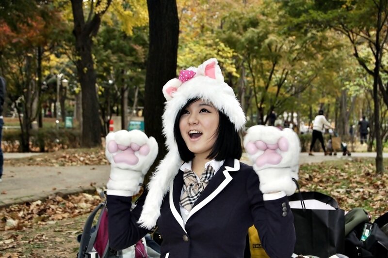 Woman in cat costume at park