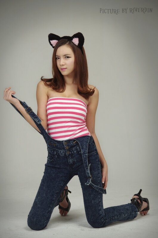 woman in cat ears and overalls