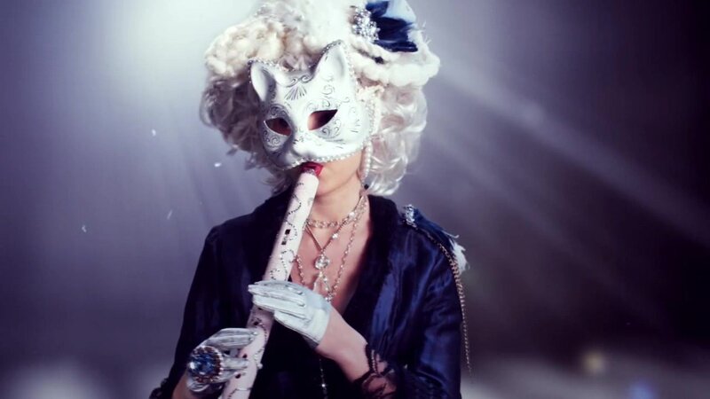woman in cat mask with flute