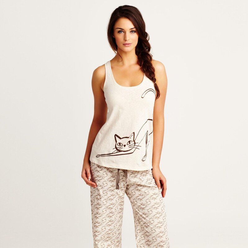 woman in cat-themed pajamas
