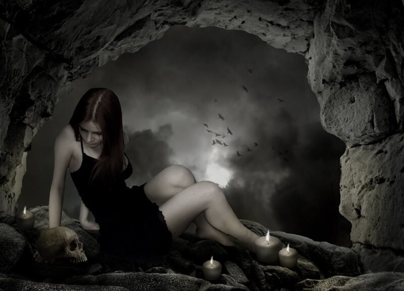 woman in cave with candles