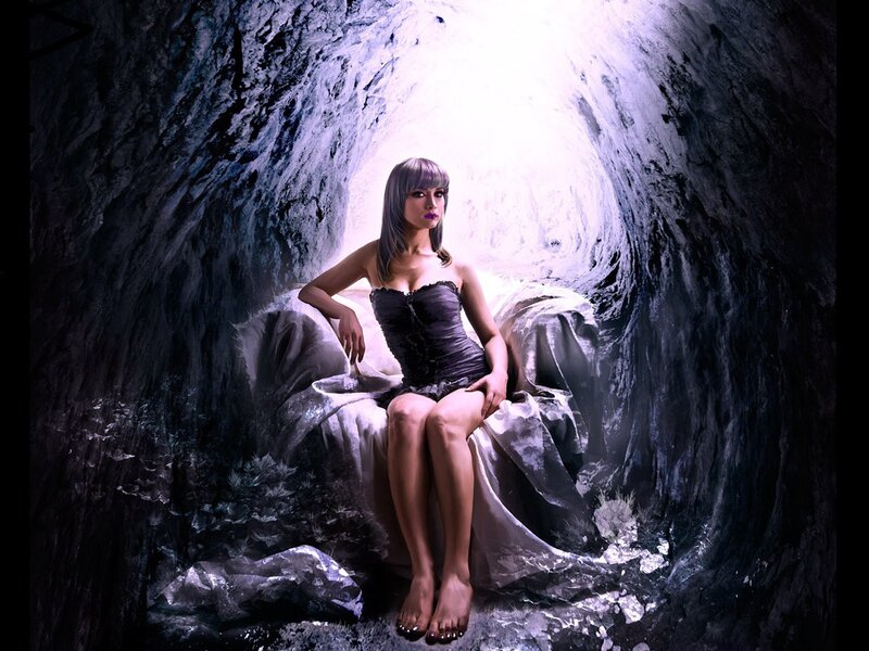 woman in cave with light
