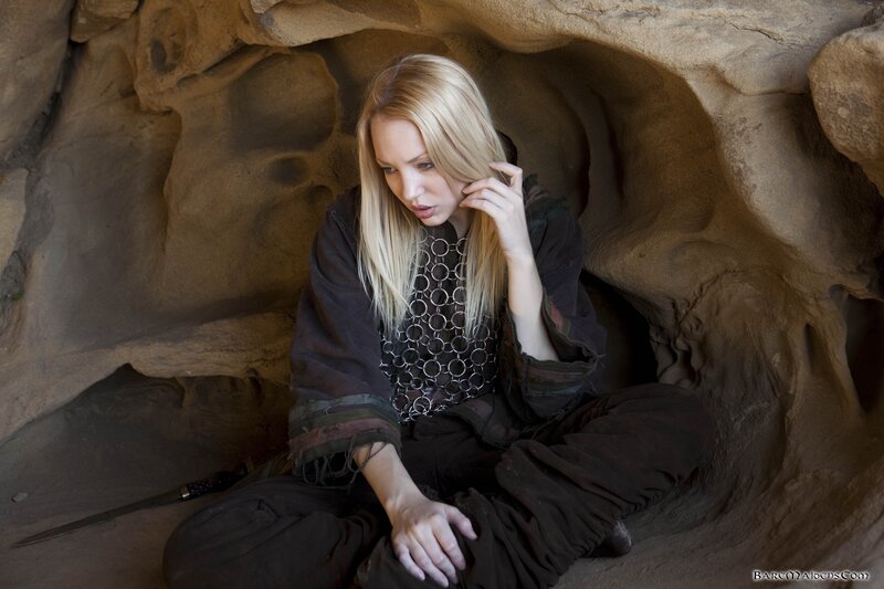 woman in cave with sword