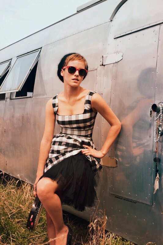 Woman in checkered dress by trailer