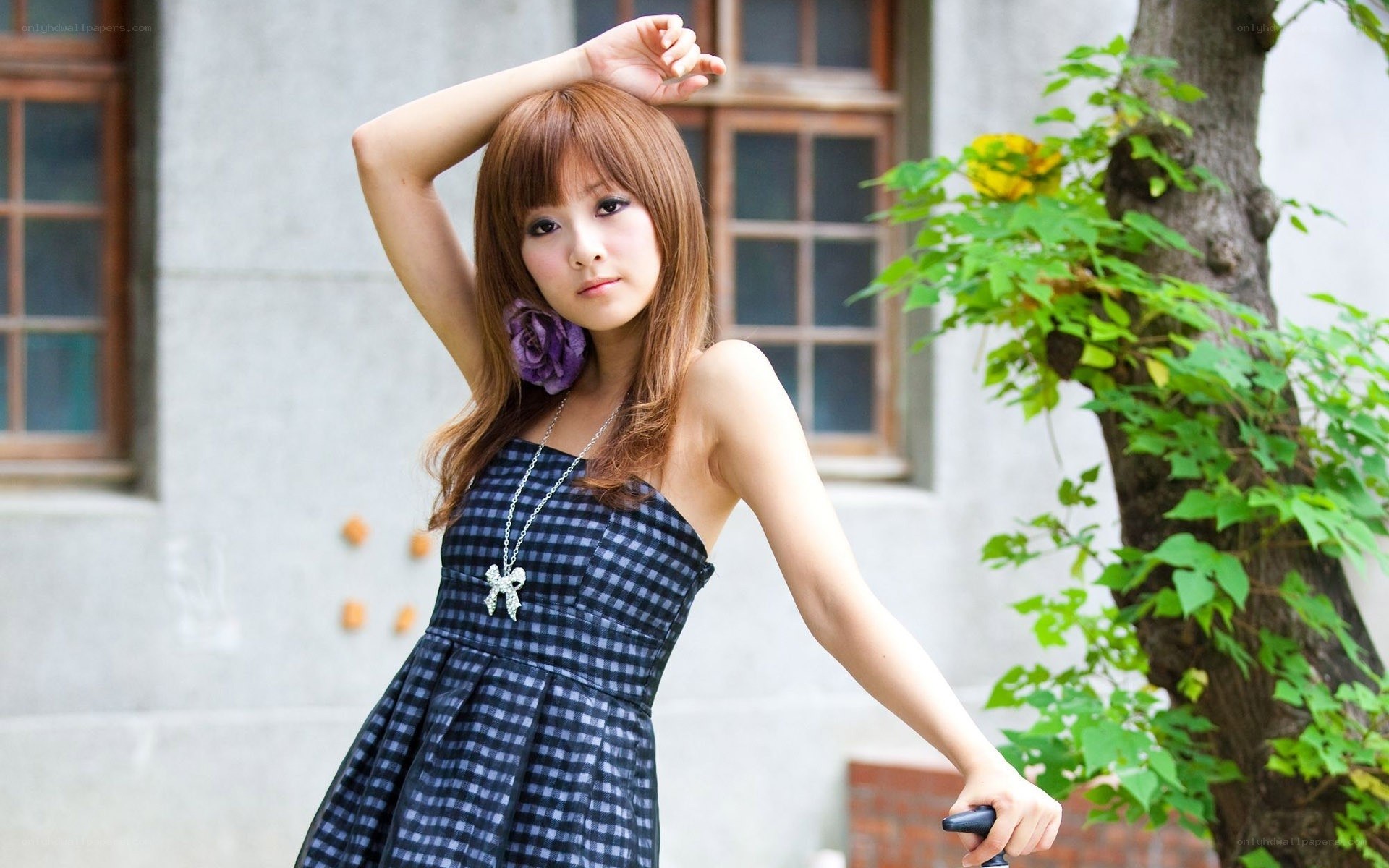 woman in checkered dress outdoors
