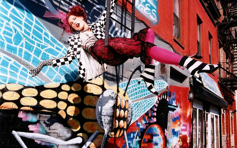 woman in checkered jacket on street