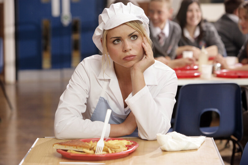 woman in chef uniform at school cafeteria