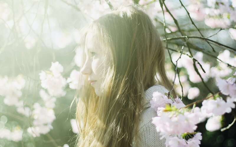 woman in cherry blossoms