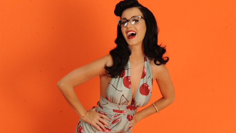 woman in cherry dress laughing