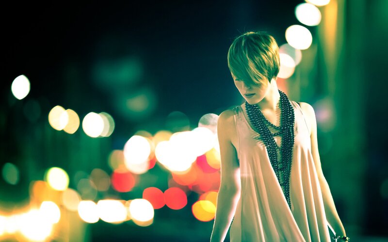 woman in city at night