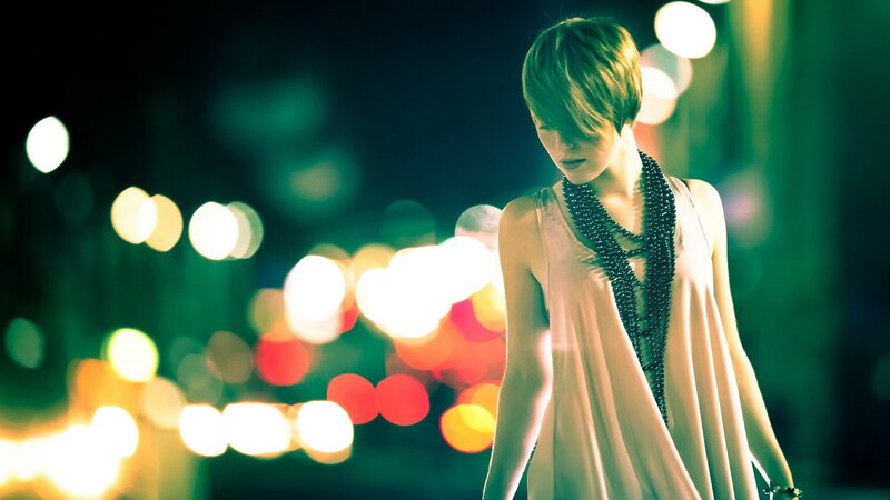 woman in city at night