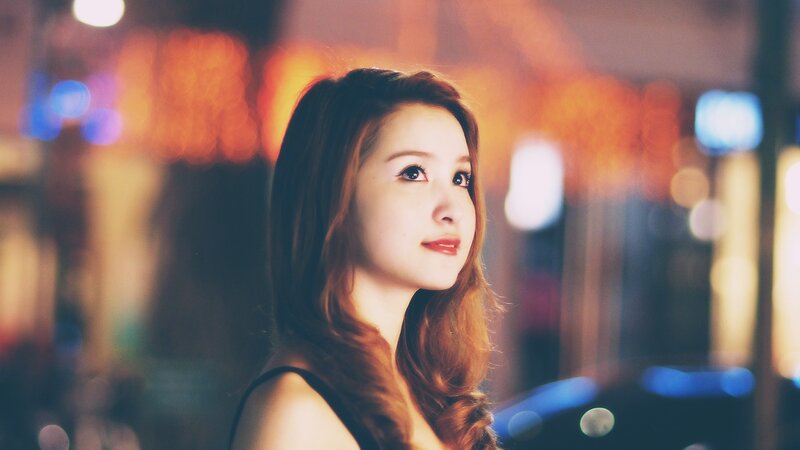 woman in city at night