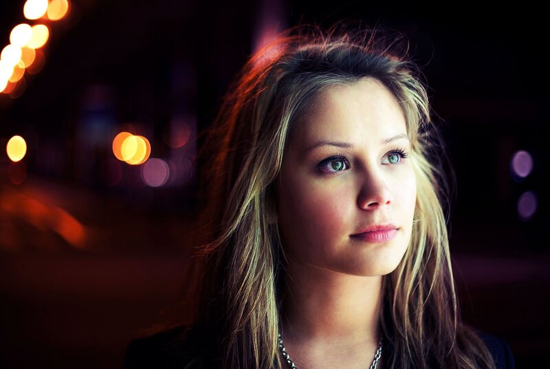 woman in city at night
