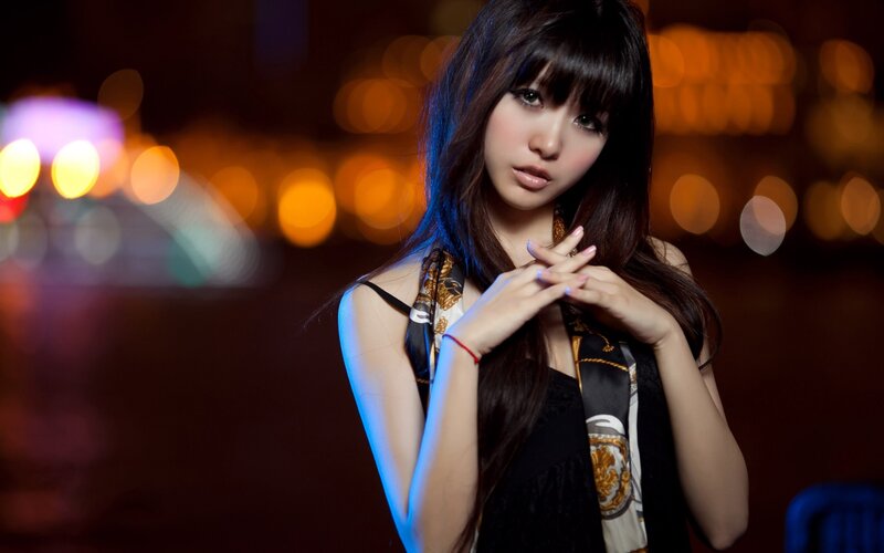 woman in city at night