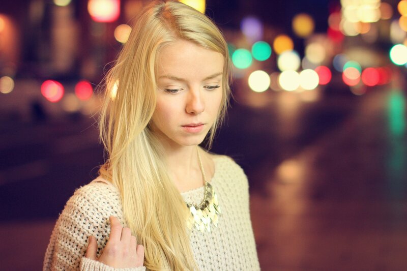 woman in city at night