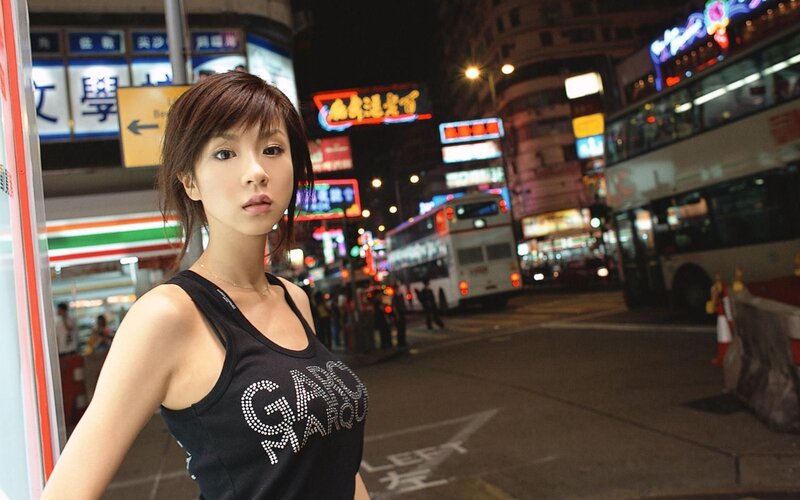 woman in city at night