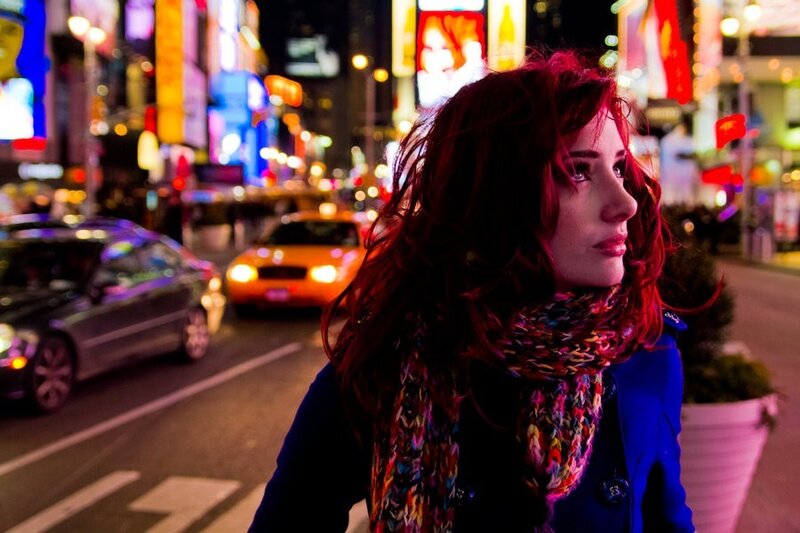 woman in city at night