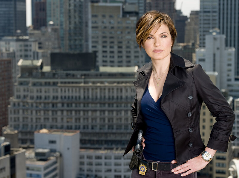 woman in city with gun