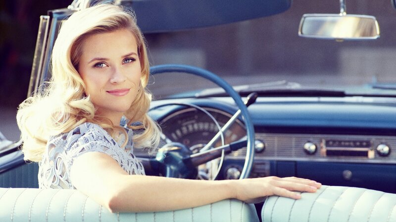 woman in classic car