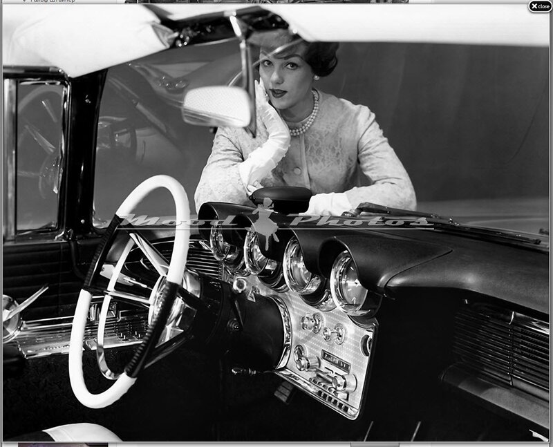 Woman in classic car interior