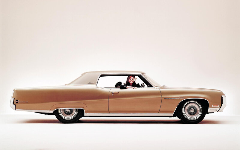 woman in classic car