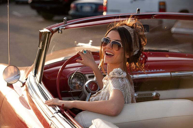 Woman in classic red convertible
