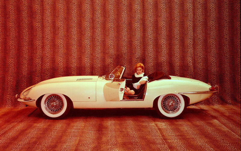 Woman in classic white car