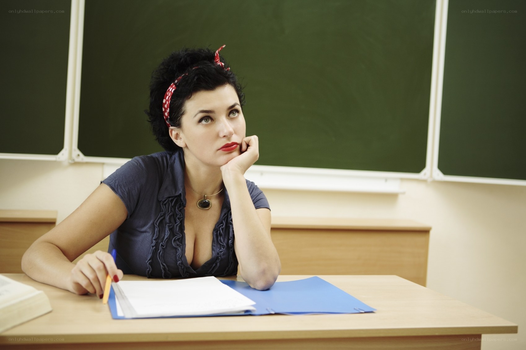 Woman in classroom thinking