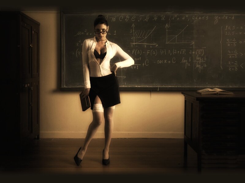 Woman in classroom with chalkboard