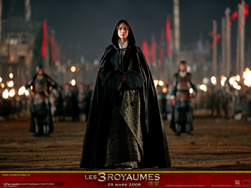 Woman in cloak on battlefield