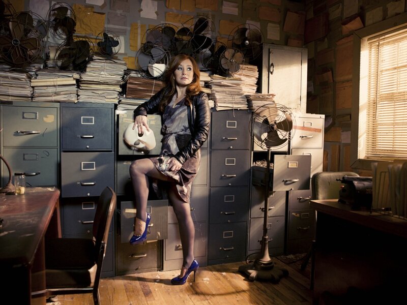 Woman in cluttered office
